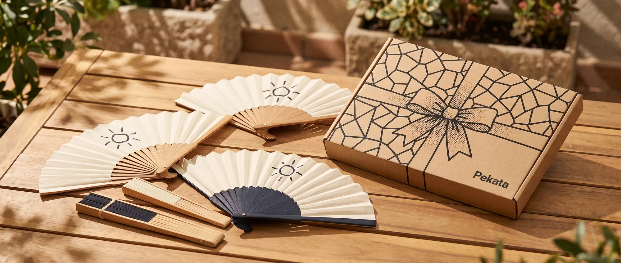 Custom bamboo folding hand fans and cardboard paddle fans with a company logo